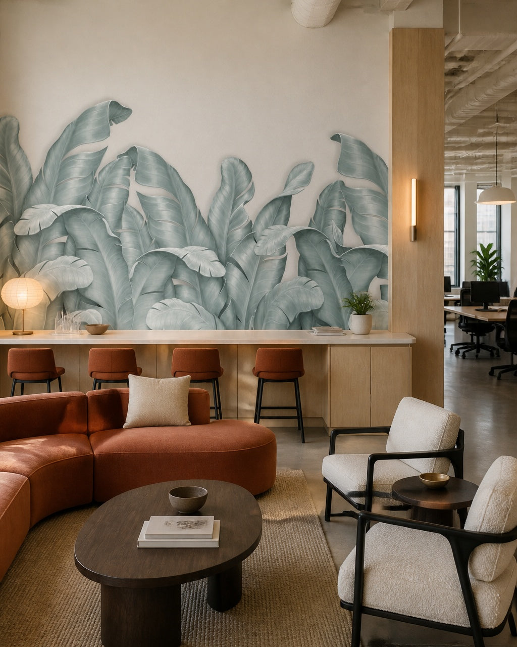 Sage banana leaves wallpaper in a creative office lounge.
