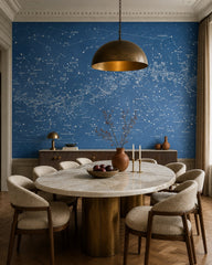 Star constellations wallpaper in a refined dining area.