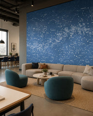 Star constellations wallpaper in a creative office lounge.