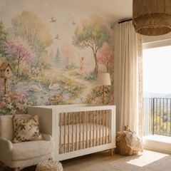 Pastel ballerina wallpaper with swans, blooming trees and floral pond displayed in a warm neutral nursery.