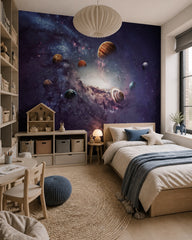 Outer space wallpaper in a girl’s bedroom.