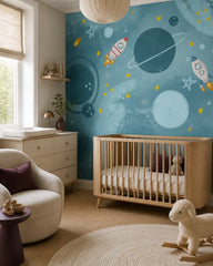 Rocket adventures through the stars kids room wallpaper in a modern nursery with a crib.