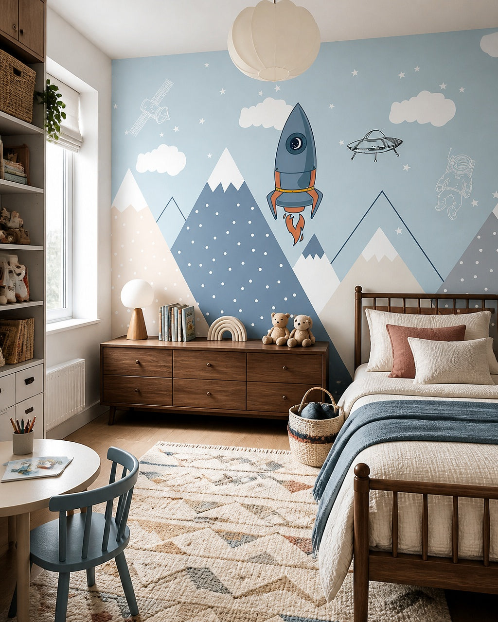 Space adventures above the mountains kids room wallpaper in a girl’s bedroom.