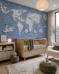 Blue cosmic world map & astronauts kids’ wall mural in a modern nursery with a crib.