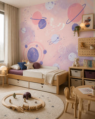 Dreamy pink space adventure nursery wallpaper in a toddler bedroom with a child-sized bed.