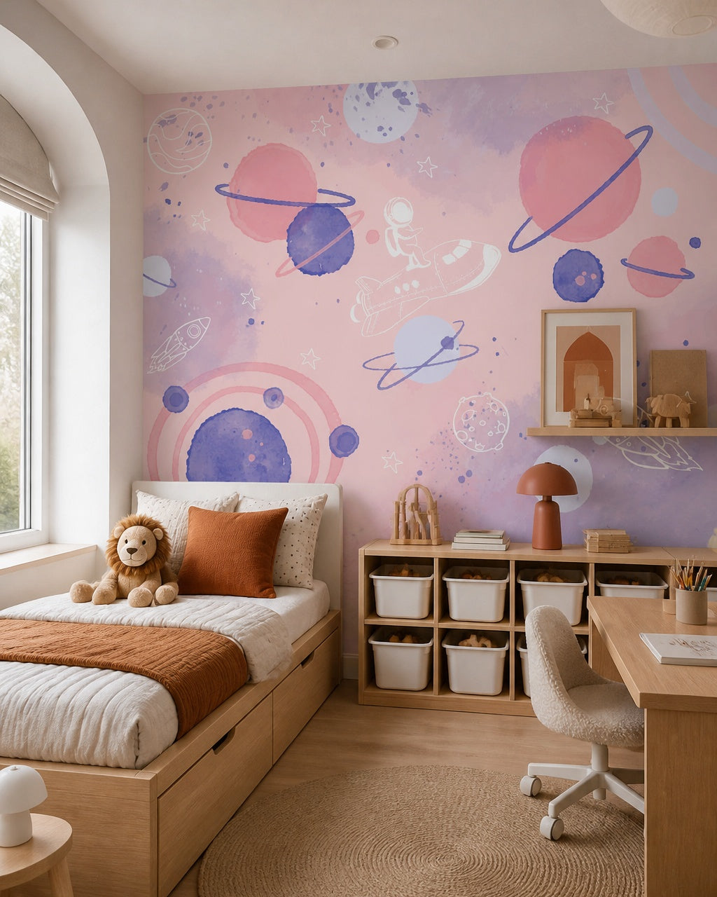 Dreamy pink space adventure nursery wallpaper in a boy’s bedroom.