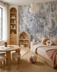 Grey music notes wallpaper in a kids’ bedroom with a round table and a house-shaped shelf.