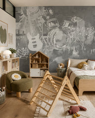 Grey guitar and drums wallpaper in a kids’ bedroom with a wooden play triangle and a house-shaped shelf.