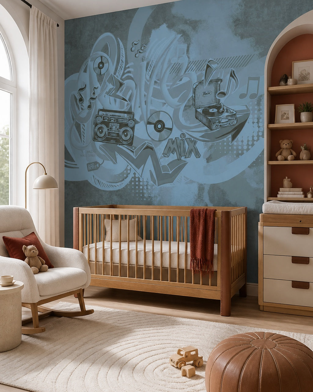Blue graffiti music wallpaper in a nursery with a wooden crib and arched shelving.