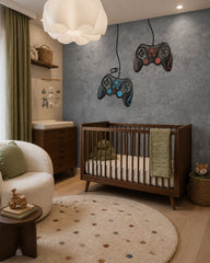 Grey concrete gamer wallpaper with game controllers in a nursery with a dark wood crib and a cream armchair.