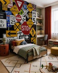 Road signs wallpaper in a toddler bedroom with a child-sized bed.
