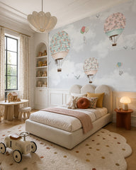 Rose garden hot air balloons wallpaper in a toddler bedroom with a child-sized bed.