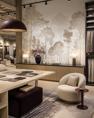 Neutral tree silhouette wallpaper in a design showroom.