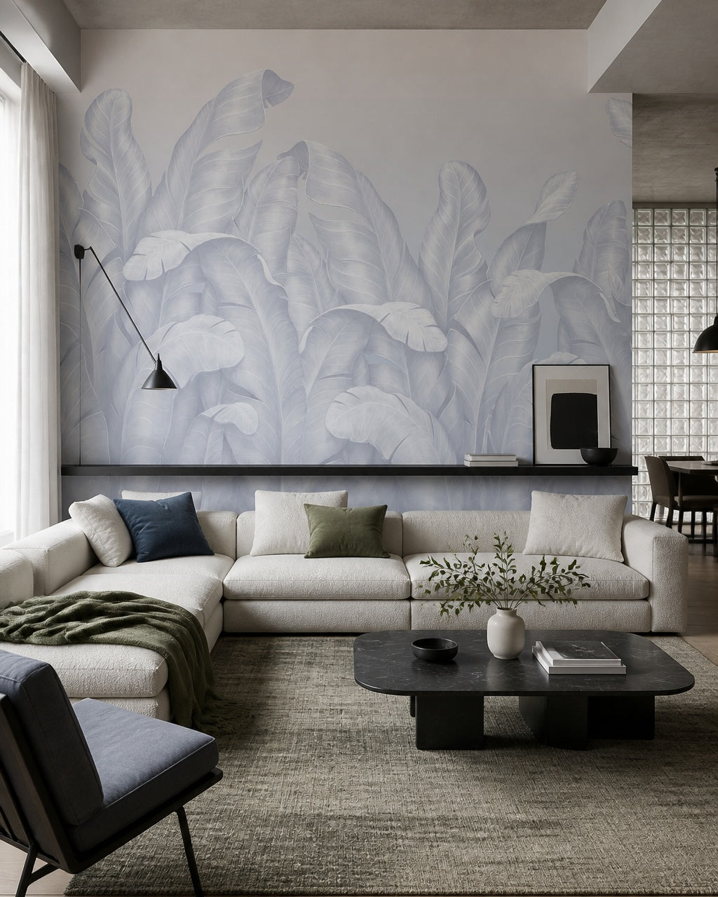Pale blue banana leaves wallpaper in a designer living room.