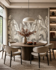 Silver banana leaves wallpaper in a refined dining area.