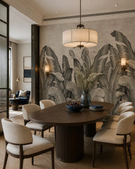 Banana leaf fresco wallpaper in a refined dining area.