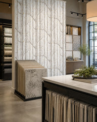 Birch forest wallpaper in a design showroom.