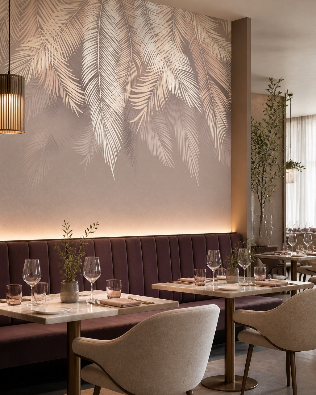 White and beige palm leaves wallpaper in a restaurant.