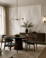 White palm fronds wallpaper in a refined dining area.