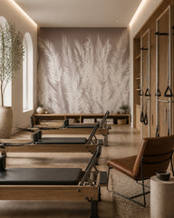 Taupe palm fronds wallpaper in a fitness studio.