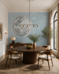 Giant full moon wallpaper in a refined dining area.