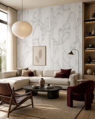 Grey line art leaves wallpaper in a designer living room.