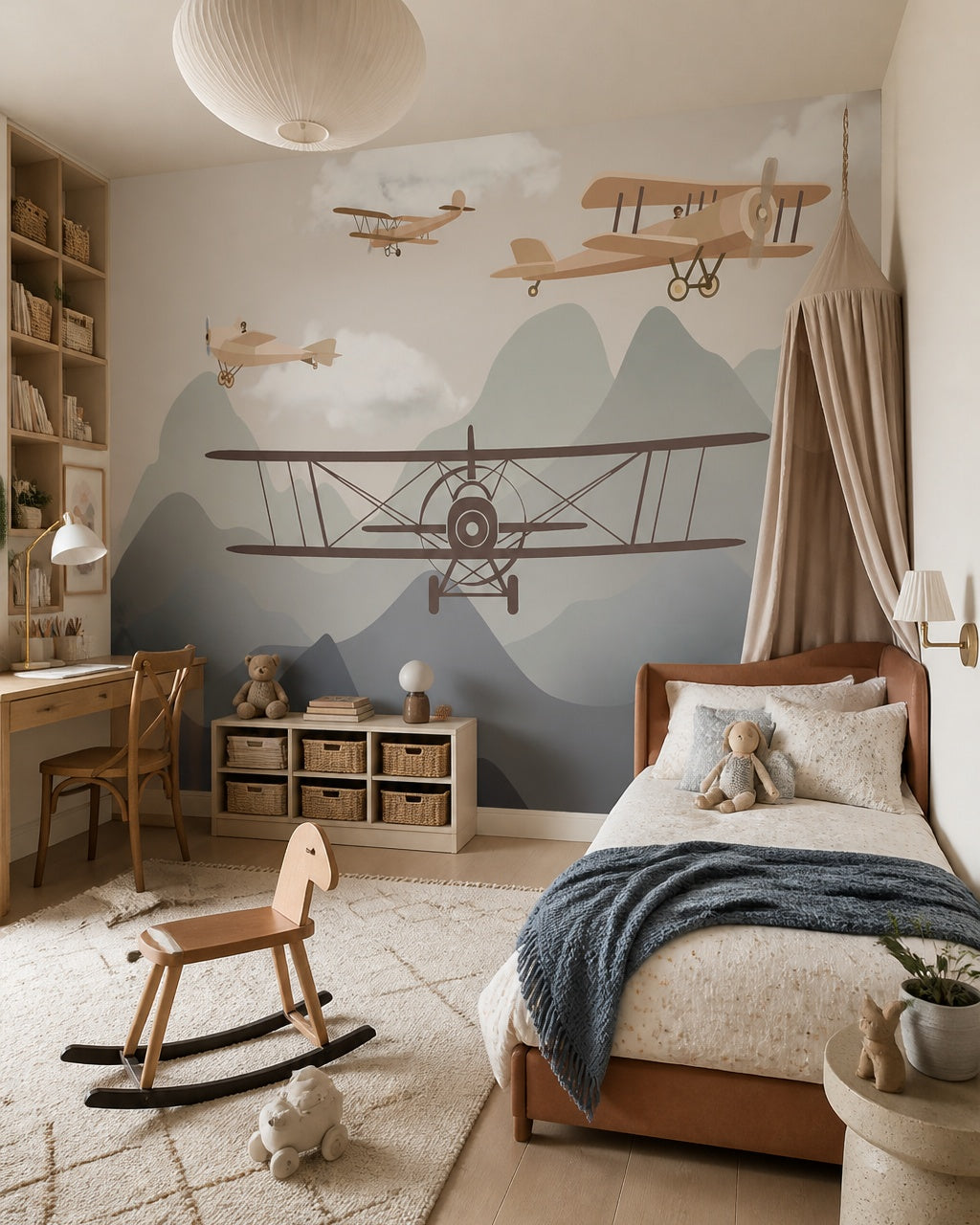 Vintage airplanes over the mountains kids room wallpaper in a girl’s bedroom.
