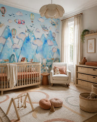 Sky adventures above the mountains kids room wallpaper in a modern nursery with a crib.