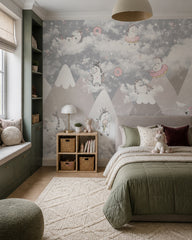 Playful unicorns above the mountains nursery wallpaper in a girl’s bedroom.