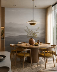 Misty mountain range wallpaper in a refined dining area.