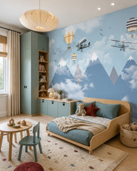 Vintage flights above misty mountains wallpaper in a toddler bedroom with a child-sized bed.
