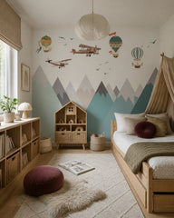 Vintage airplanes and balloons over mountains wallpaper in a girl’s bedroom.