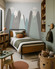Happy snowy mountains kids room wallpaper in a boy’s bedroom.