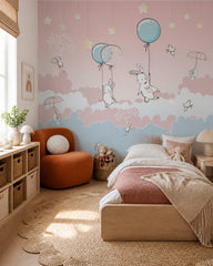 Bunnies with balloons wallpaper in a girl’s bedroom.