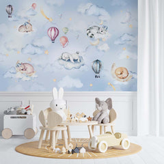 Sleepy animals on clouds with hot air balloons on a blue watercolor sky