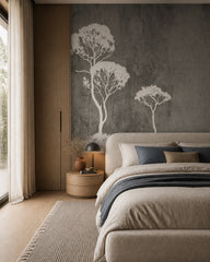 White trees on grey concrete wallpaper in a designer bedroom.
