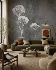 White trees on grey concrete wallpaper in a designer living room.