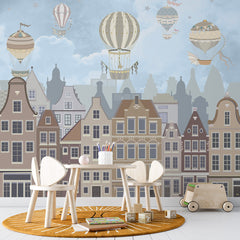 Old city houses with hot air balloons in a blue sky wall mural