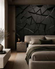 Black 3D geometric wallpaper in a designer bedroom.