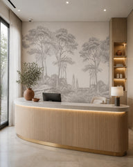 Grey engraving trees wallpaper at a hotel reception desk.