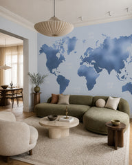 Blue world map wallpaper in a designer living room.