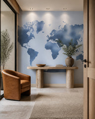 Blue world map wallpaper in a refined foyer.