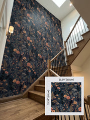 Navy wildflower wallpaper on a staircase wall, shown with a 65 cm (25.6 in) pattern sample.