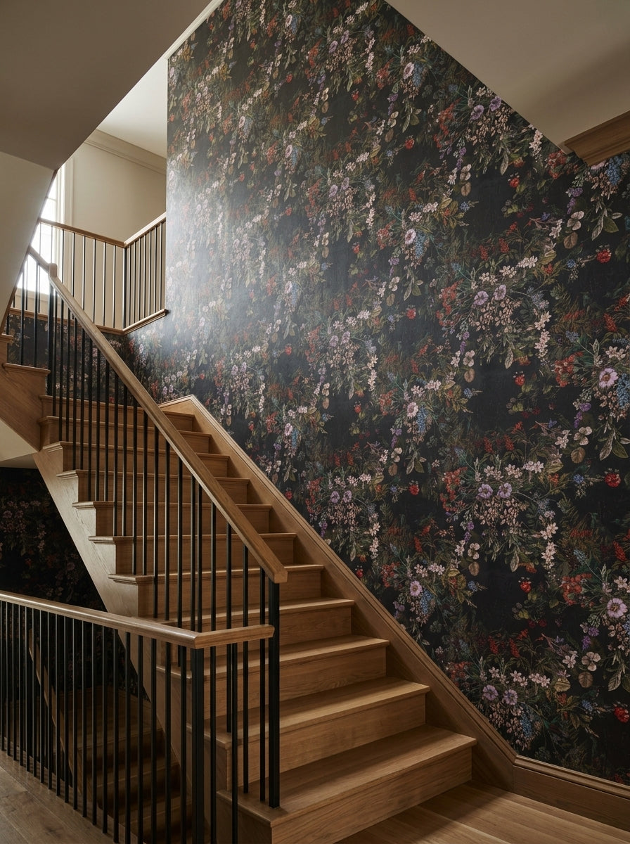 Dark botanical bouquet wallpaper on a staircase wall.
