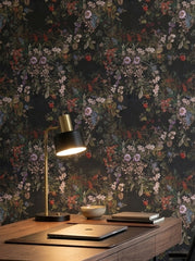Dark botanical bouquet wallpaper in a home office.