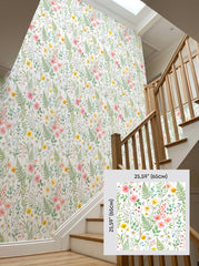 Wildflower meadow wallpaper on a staircase wall, shown with a 65 cm (25.6 in) pattern sample.