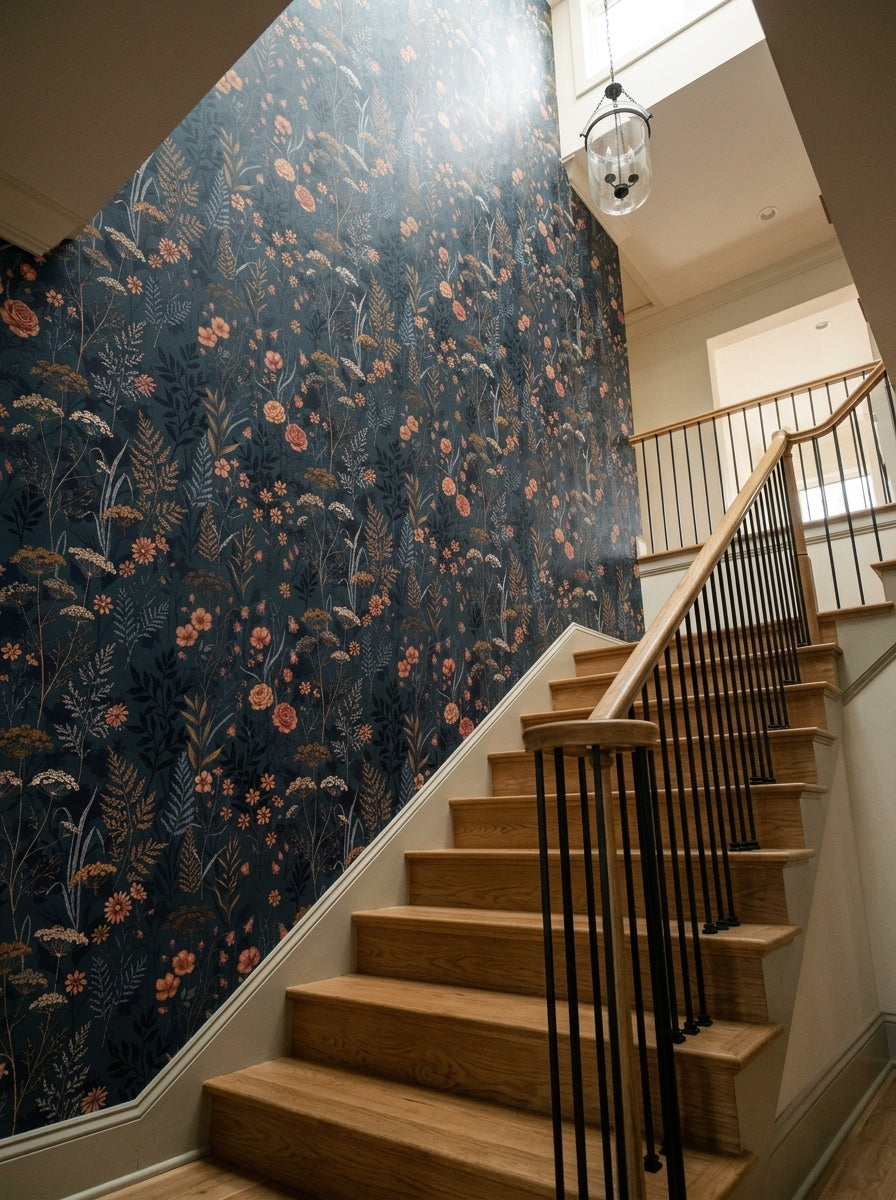 Navy meadow wallpaper on a staircase wall.