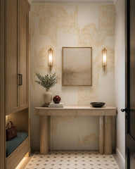 Cream and gold line art waves wallpaper in a designer entrance hall.