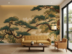Japanese pine tree wallpaper on gold behind a mustard sofa in a modern living room.