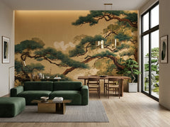 Japanese pine tree wallpaper on gold in an open living and dining room with green sofa.